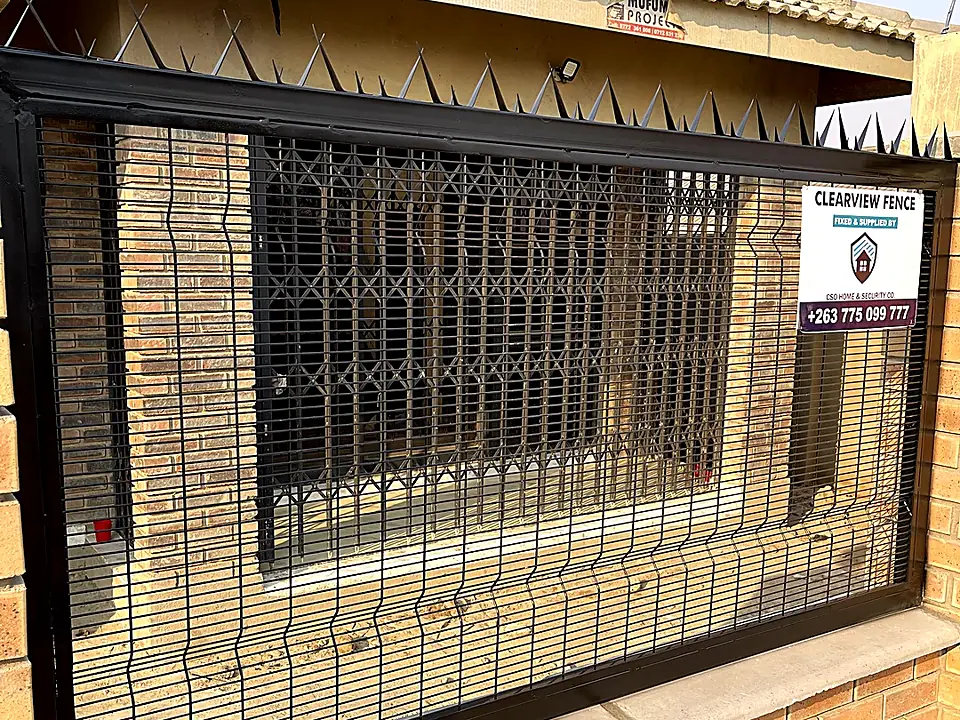 Clearview fence with security spikes between brick pillars in Glenview 3, Harare